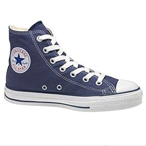 Worn navy blue high top converse.